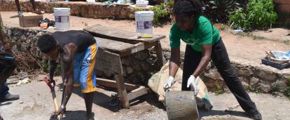 A volunteer helping to build a school at her Building Project placement A Projects Abroad volunteer helping to build a school at her Spring Break Building Project